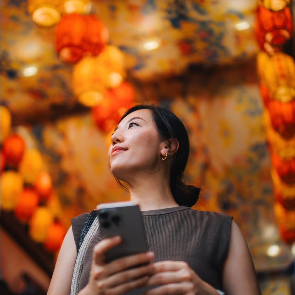 woman using phone indoors
