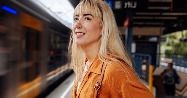 woman-standing-by-a-train