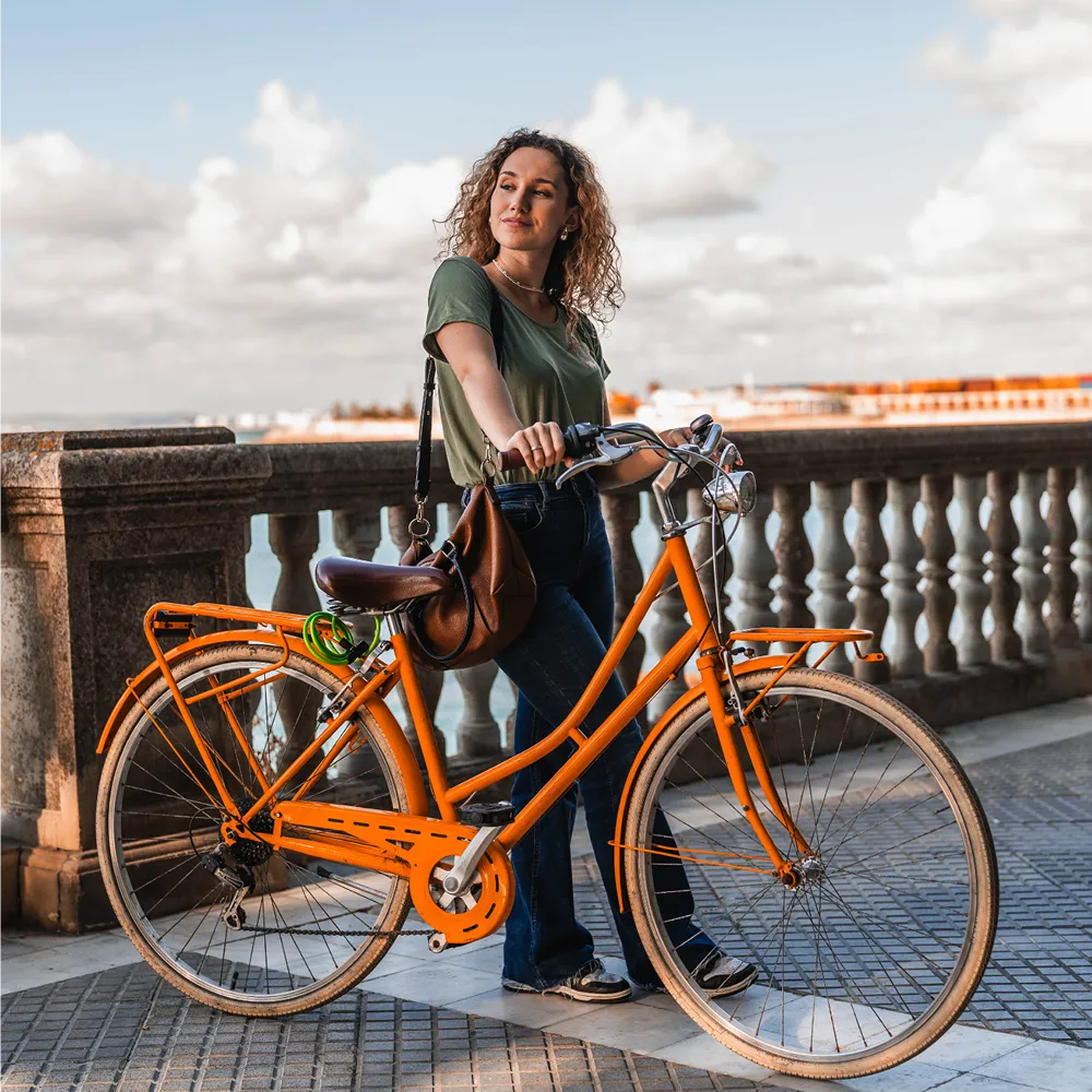 woman standing next to a bike outdoors